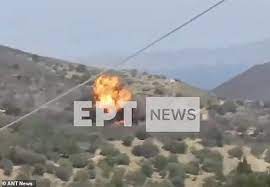 Horrifying moment firefighting plane carrying at least two clips a tree before crashing and exploding in a canyon on a Greek island