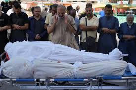 Injured and dead brought to Deir al-Balah hospital after separate Israeli airstrikes in Gaza Strip