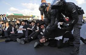 Orthodox Jewish protesters against military service law forcibly removed by police in Jerusalem