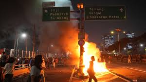 Ratification of Indonesian election law changes delayed as protesters try to storm parliament