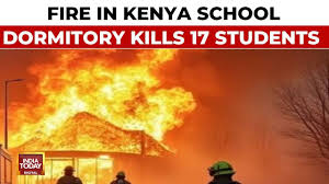 Kenyan officials remove bodies as they try to confirm the death toll from a school dormitory fire