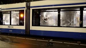 Amsterdam police warn of fresh calls for unrest a day after rioters torch a tram
